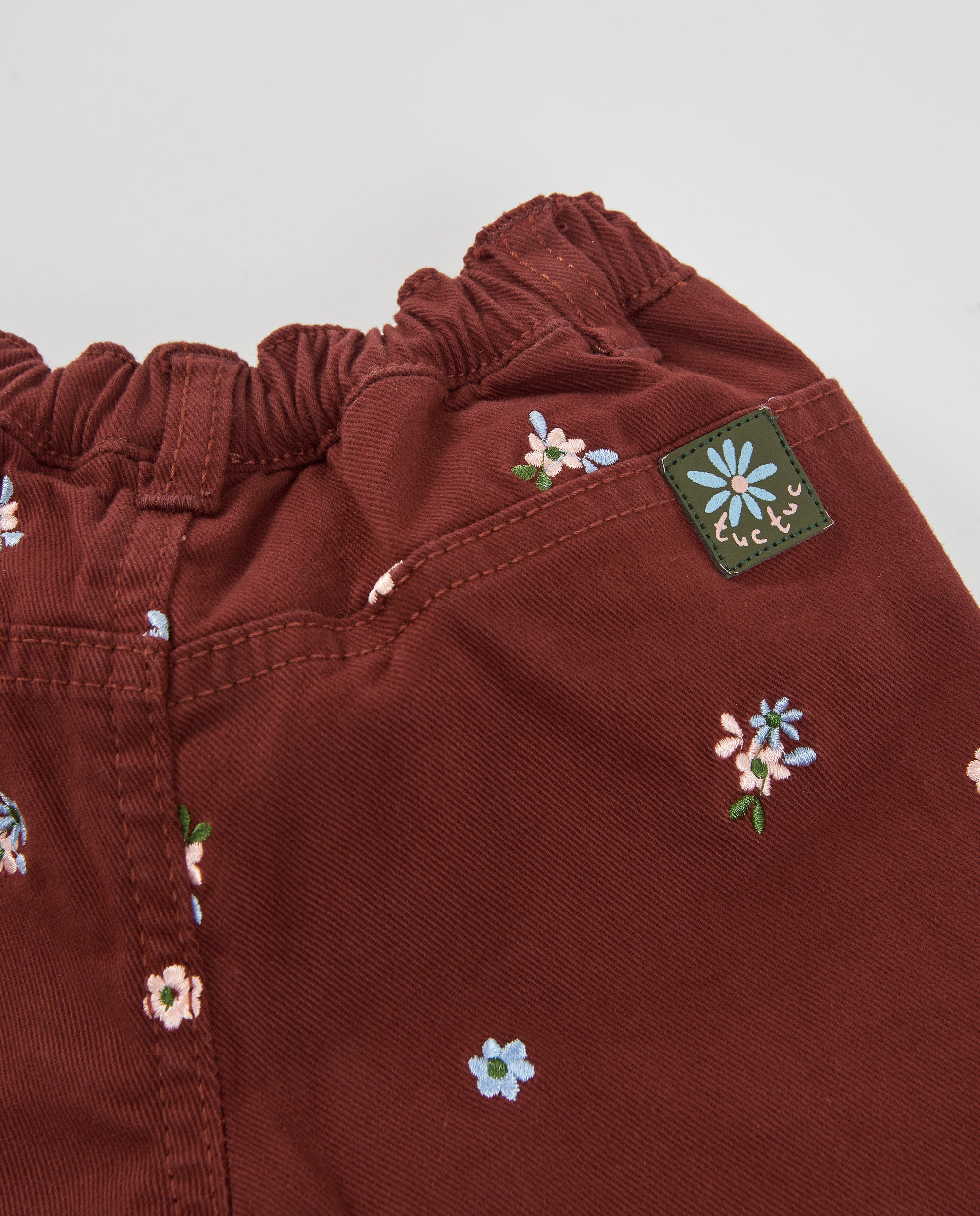 TucTuc Pantaloni bambina tela ricamo floreale bordeaux