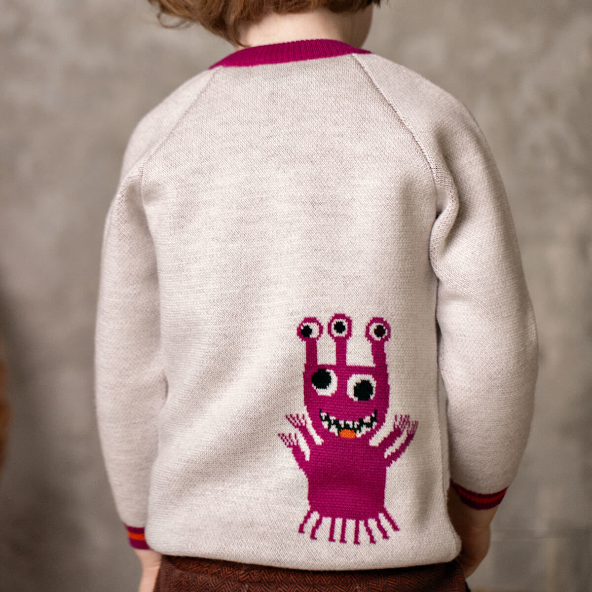 Pamboo maglione bimbo lana merino blu mostro arancione